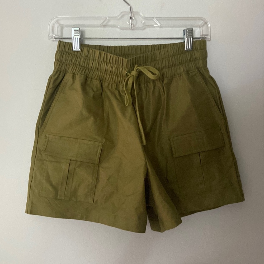 Small green Fabletics hiking/athletic shorts.